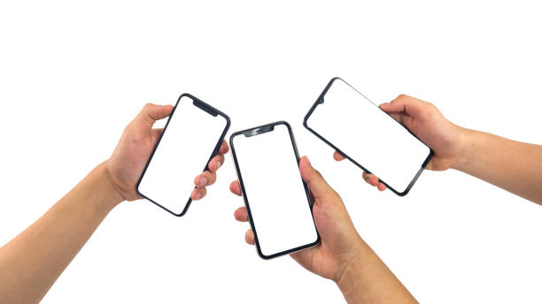 istock hands using smartphone with blank screen, isolated on white background, Close up of hand holding modern smart phone mockup. New modern black frameless smartphone mockup with blank white screen. 1969214880