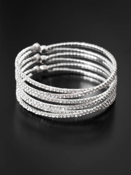 istock Silver bracelet isolated on black background 1969217461