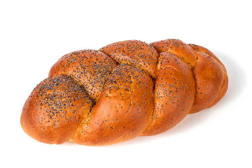 Challah bun on a white background. Close-up of a bakery product.