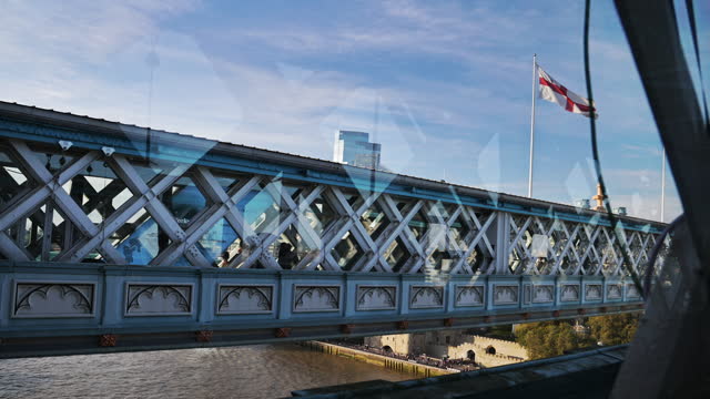 England flag flying over Tower Bridge