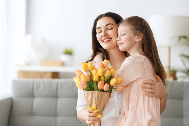 istock daughter and mom with flowers 1969260324