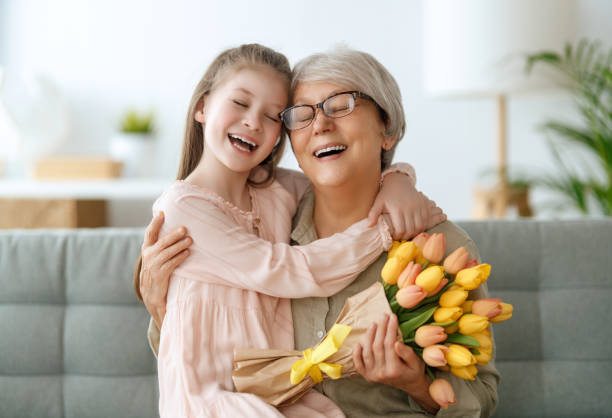 istock Grandma and girl smiling and hugging 1969261172