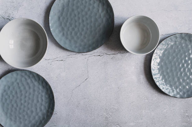 istock modern dishware collection in rustic grey and beige tones. Trendy ceramic plates. 1969279842