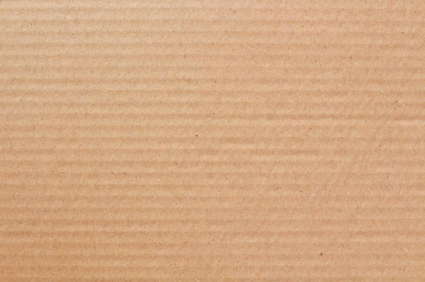 Cardboard sheet texture background, detail of recycle brown paper box pattern.