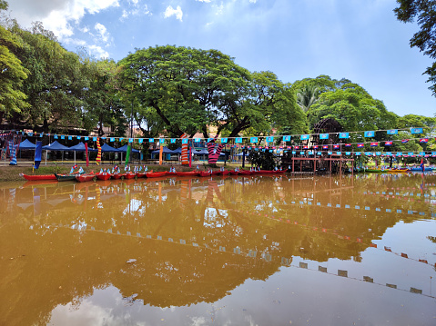 Dragon boats moored on the Siem Reap river for the upcoming 2023 Water festival or Bon Om Tuk of 2023, that traditionally marks the end of the monsoon period and rice season, Cambodia.