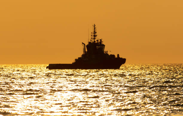 istock Boat at sea at sunset 1969347377