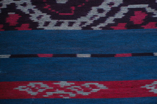 istock strip texture and tribal pattern on blue and red woven fabric 1969347882