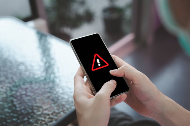 istock Person using mobile smartphone and receive emergency alert notification. 1969351038