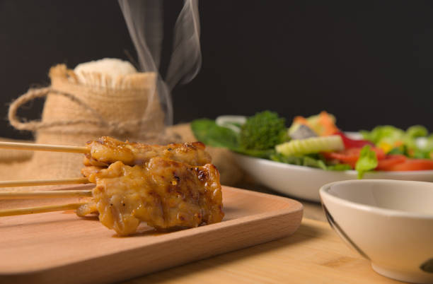 Grilled pork with Sticky rice that is easily found in Thailand.