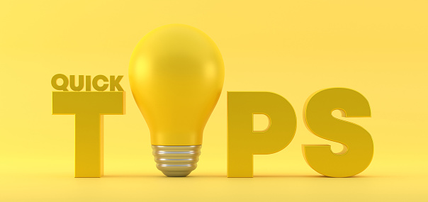 Quick Tips With Light Bulb On Yellow Background