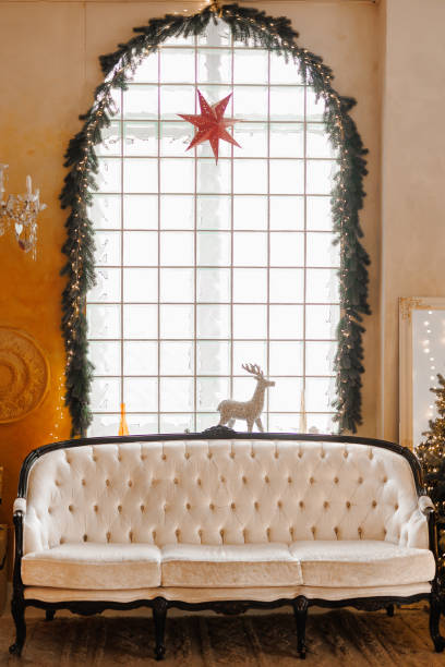 istock Bright interior with a large Christmas decorated window 1969381526