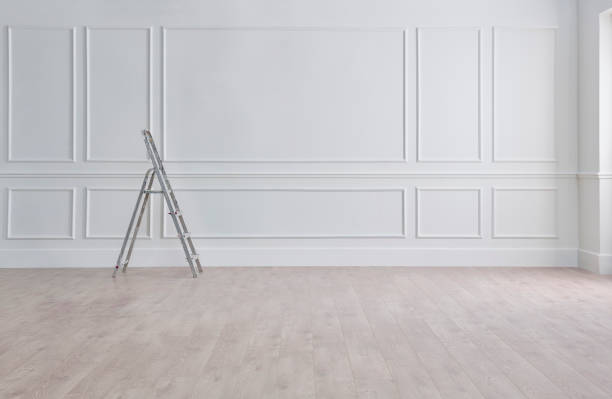 istock White classic wall, stairs, paint and brush, interior whitewash. 1969387965