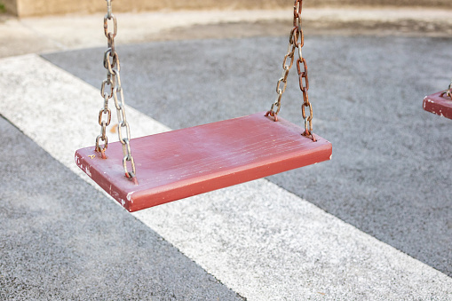 Empty chain swing in the playground