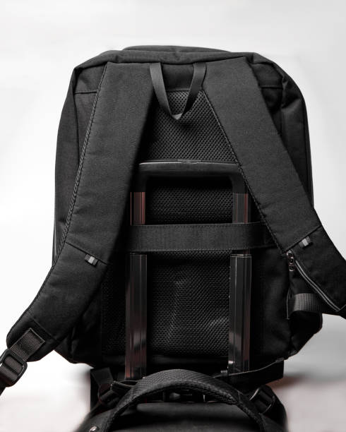 istock attachment for the handle of the suitcase on the back of a black backpack 1969407125