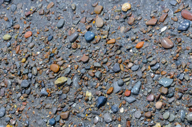 Kara-Dag, a round sea-rolled pebble from a volcanic rock on a pebble beach, Crimea