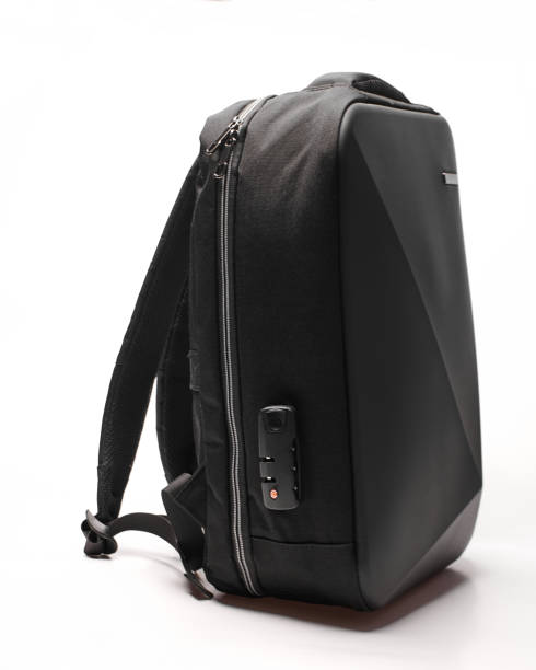 istock black backpack with asymmetrical design and matte finish, side view. youth backpack with a combination lock 1969412240