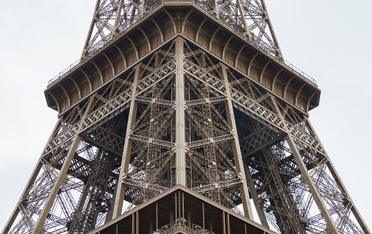 France, Paris - Jan 4, 2024 - Architectural detail design of the famous Eiffel Tower iron structure. Close-up of the framework of the Eiffel Tower in Paris, France, Space for text, Selective focus.