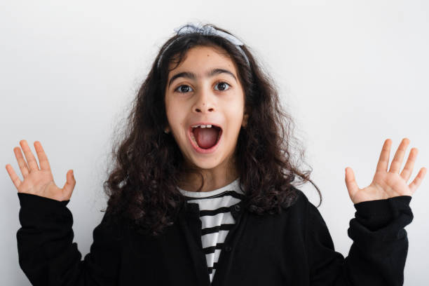 istock Little Girl with Surprised Look on White 1969422048