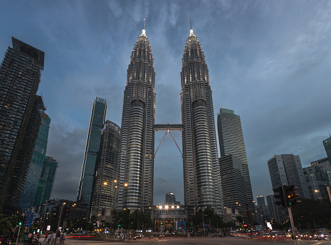 kuala lumpur, Malaysia – January 02, 2024: The Petronas Towers, a pair of interlinked 88-storey supertall skyscrapers in Kuala Lumpur, Malaysia