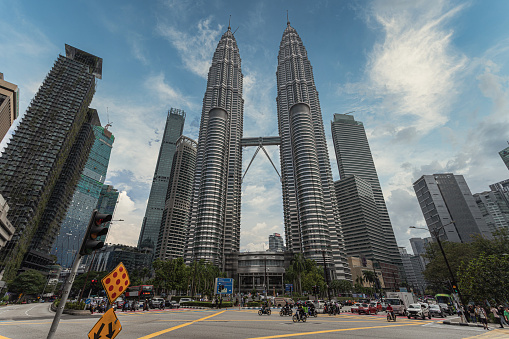 kuala lumpur, Malaysia – January 02, 2024: The Petronas Towers, a pair of interlinked 88-storey supertall skyscrapers in Kuala Lumpur, Malaysia
