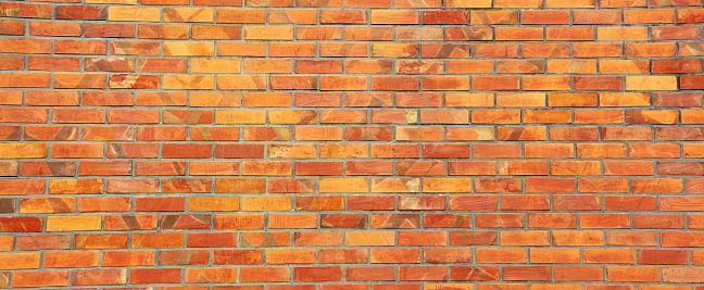 Red brick wall, panoramic view.