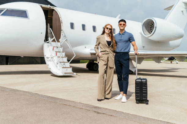 istock Multiethnic diverse passengers arriving to destination by private mid size jet. wealthy entrepreneurs using private airplane. 1969468361
