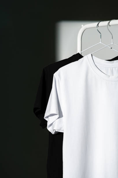 istock Blank T-shirt hanging in a spotlight in studio 1969472085