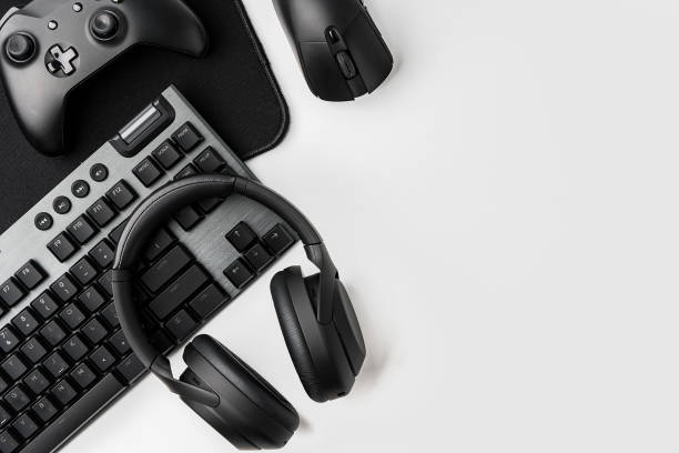 istock Top view of gamer table with computer keyboard, joystick and headphones 1969472098