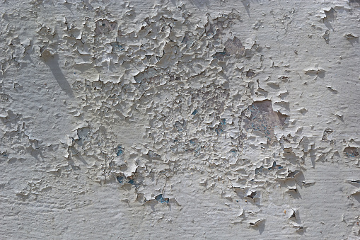 The old cracked paint on a wall surface.