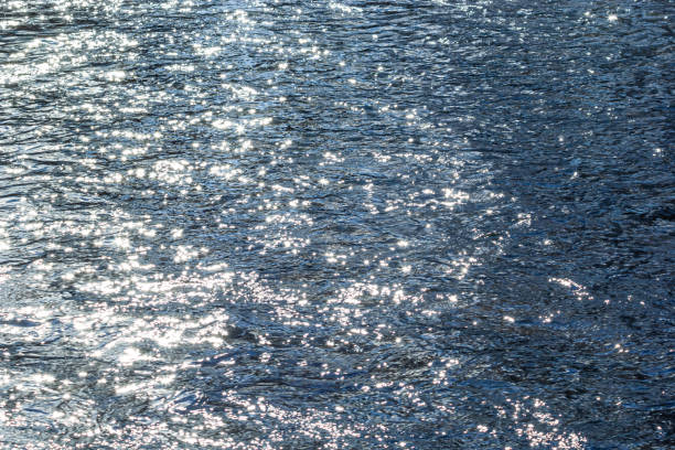 Sun reflection in water surface of Rhein river