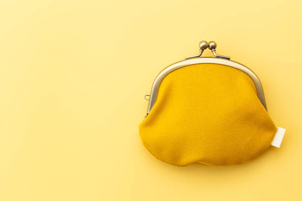 istock Coin purse on a yellow background. 1969493818