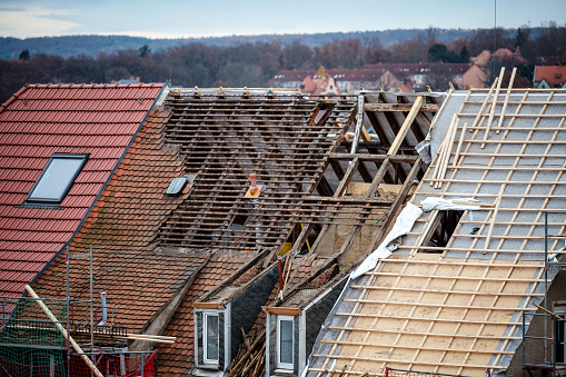 A roof that is partially covered and the roof truss has already been replaced.