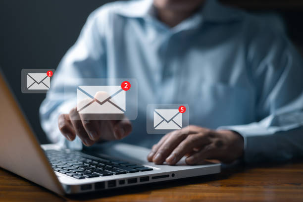 istock Email marketing concept, person reading e-mail on laptop computer, receive new message. New email notification concept for business e-mail communication and digital marketing. newsletter online. 1969495998