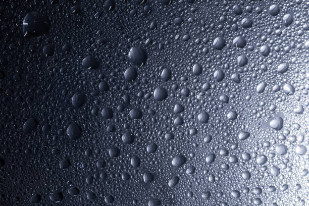 istock Drops of water on a color background. Selective focus. Gray 1969505044