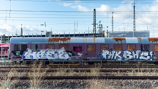 Nova Gorica, Slovenia-March 18th, 2012: colourful graffiti on train wagon, waiting for passengers on railway station