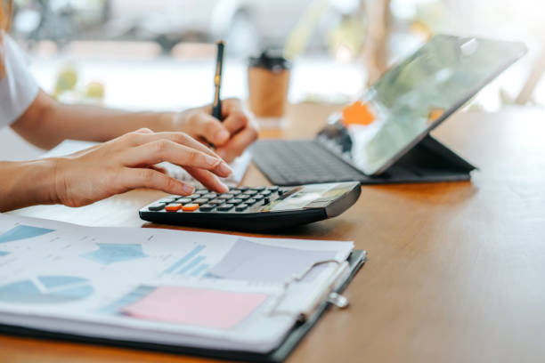 istock woman working from home using computer and document finance and conference online meeting for new projects 1969536576