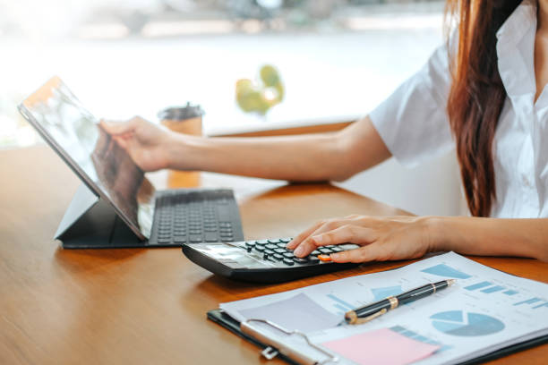 istock woman working from home using computer and document finance and conference online meeting for new projects 1969536598