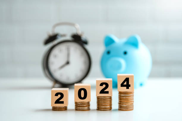 istock Saveing number year 2024 on top stack of coins saving money and financial plan concept for investment in new year 2024. 1969540944