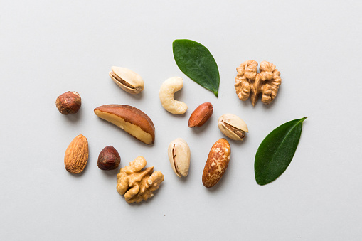 Composition of nuts , flat lay - mix hazelnuts, cashews, almonds on table background. healthy eating concepts and food background.