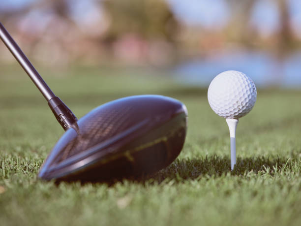 istock Golf ball and club on green grass 1969550690