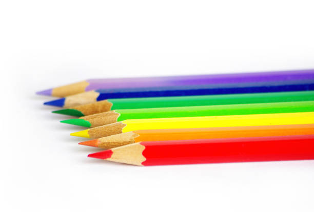 A row of colored pencils, isolated on a white background.