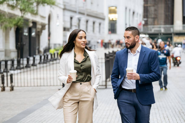 istock Manhattan business people walking and talking with coffee 1969565503