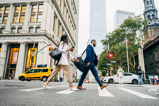 New York City, USA - July 13th, 2018. - Sign boards scattered on a lamp post shows a busy life of the city.