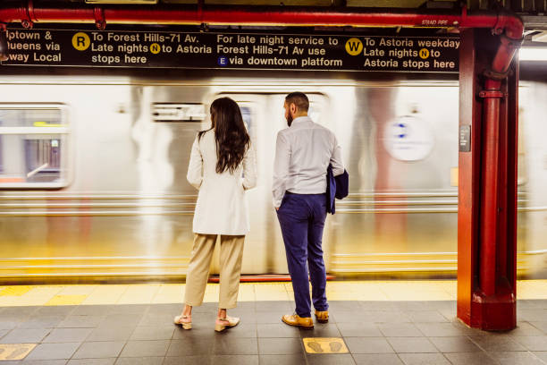 Business associates waiting for NYC subway after work