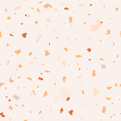 Seamless terrazzo pattern in pastel yellow, beige, terracotta and ochre on ivory background.  Vector marble texture with stone chips for wallpapers, fabric design and flooring surface