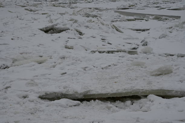 istock fragments of split people on the river, chunks of people on the river, spring ice drifting 1969590783