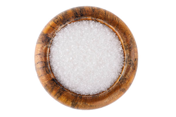 istock Wooden bowl with white sugar isolated on white background 1969595592