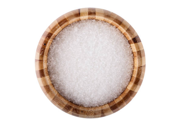 istock Wooden bowl with white sugar isolated on white background 1969595595