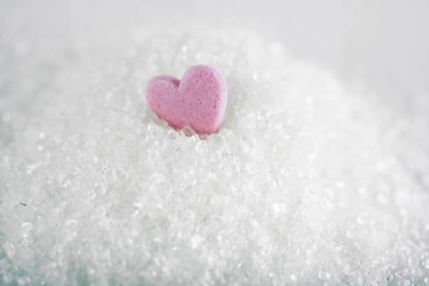 istock White crystal sugar on white background 1969599922
