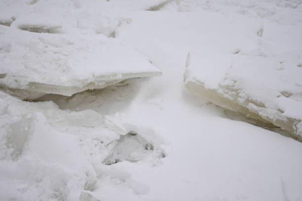 Melting sea ice seasonal natural phenomenon of coming spring, ice on water melts from burning sun. Warm greenhouse effect of weather changing, spring thaw on russian Azov sea